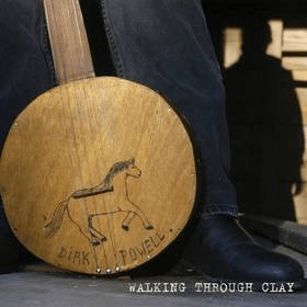 Dirk Powell walking through clay